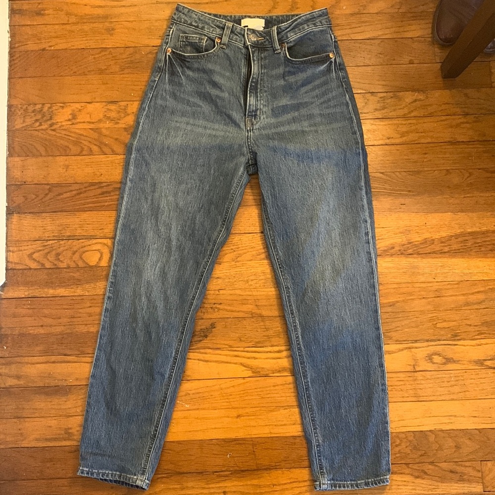 Slim, straight legged, high waisted mom jeans.
